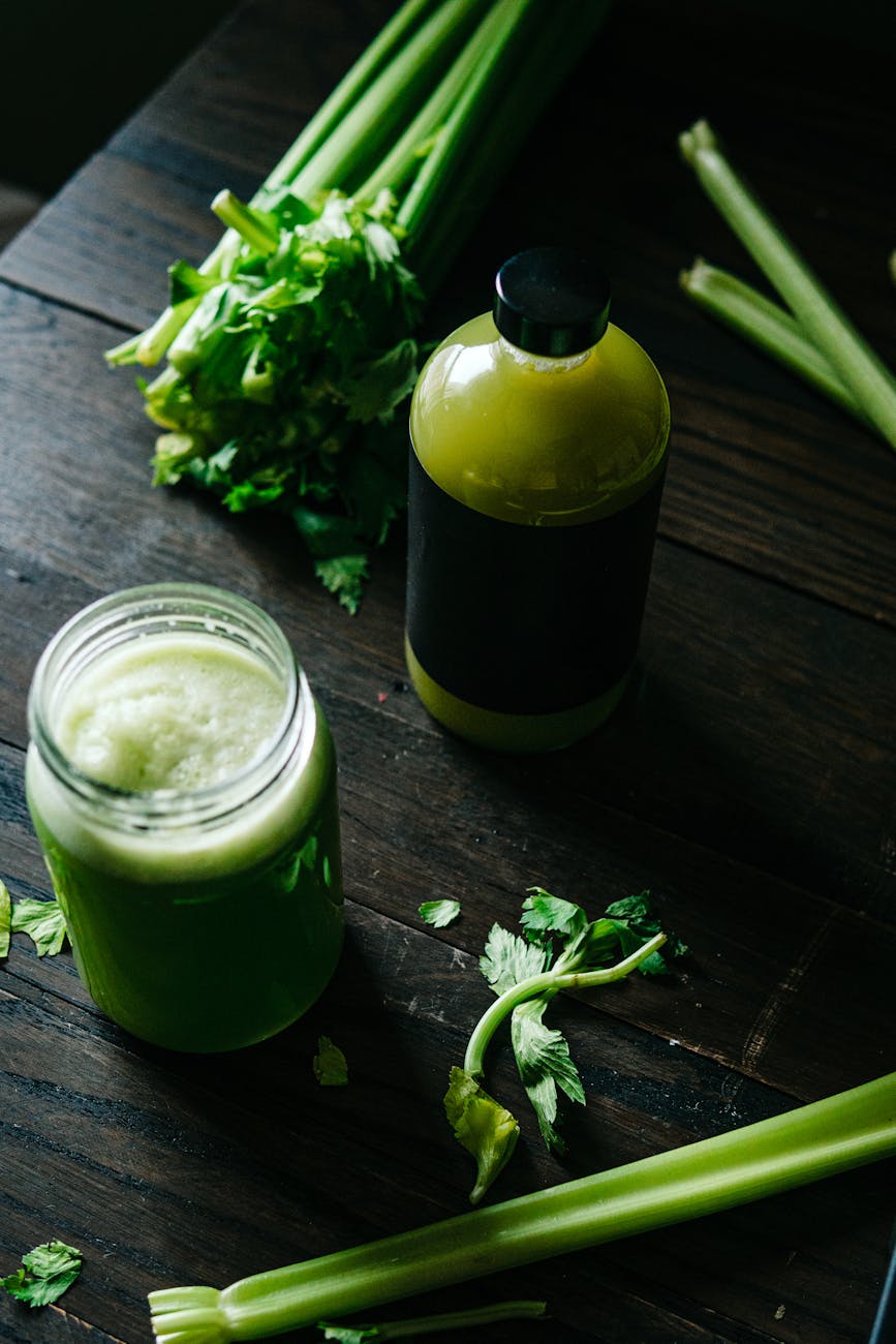 celery smoothie in jar and bottle