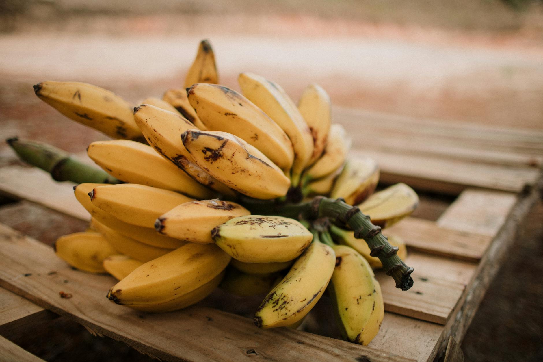 banana fruit on wood crate